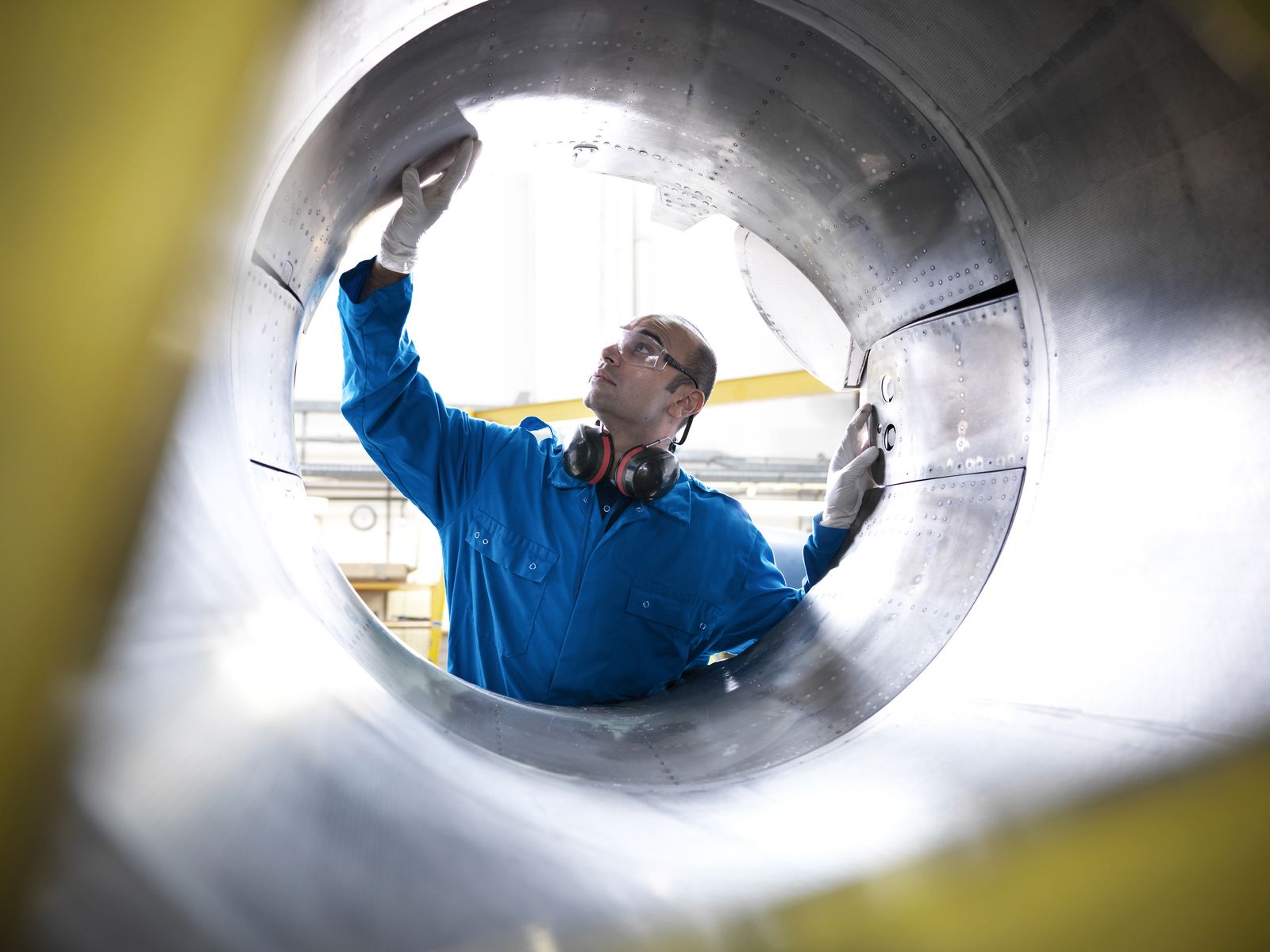 Aircraft engineer inspecting reverse thruster of 737 jet engine