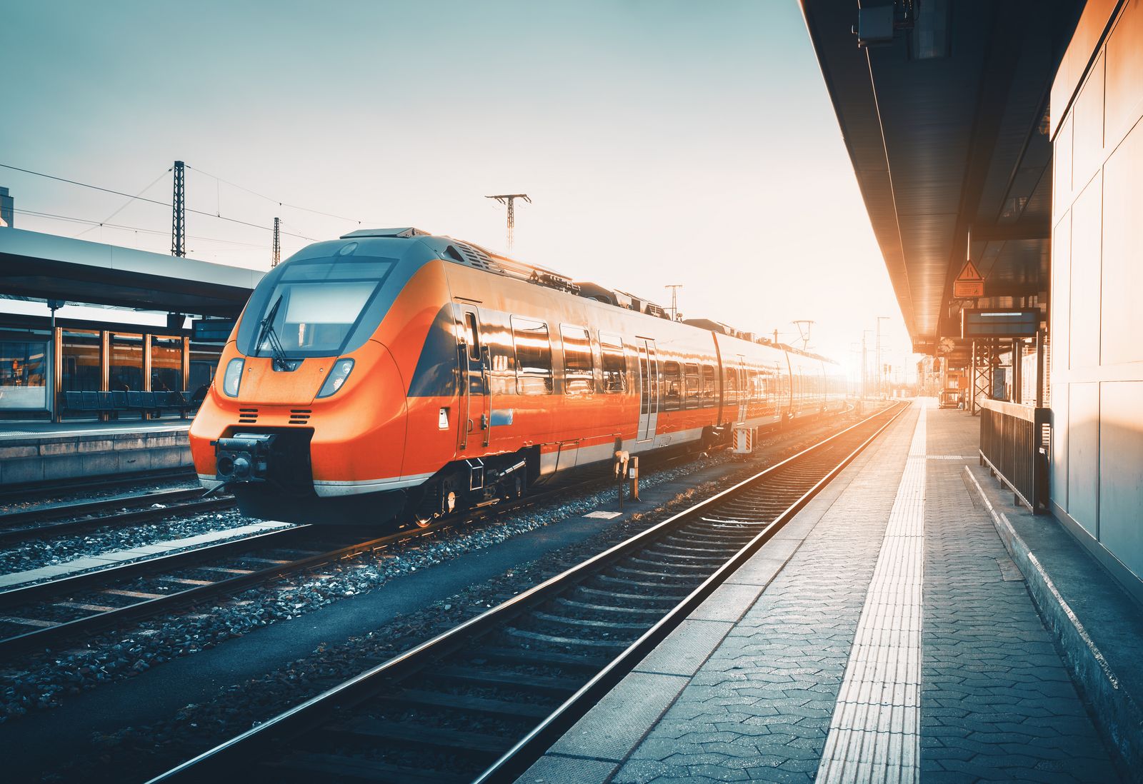 Modern,High,Speed,Red,Commuter,Train,At,The,Railway,Station