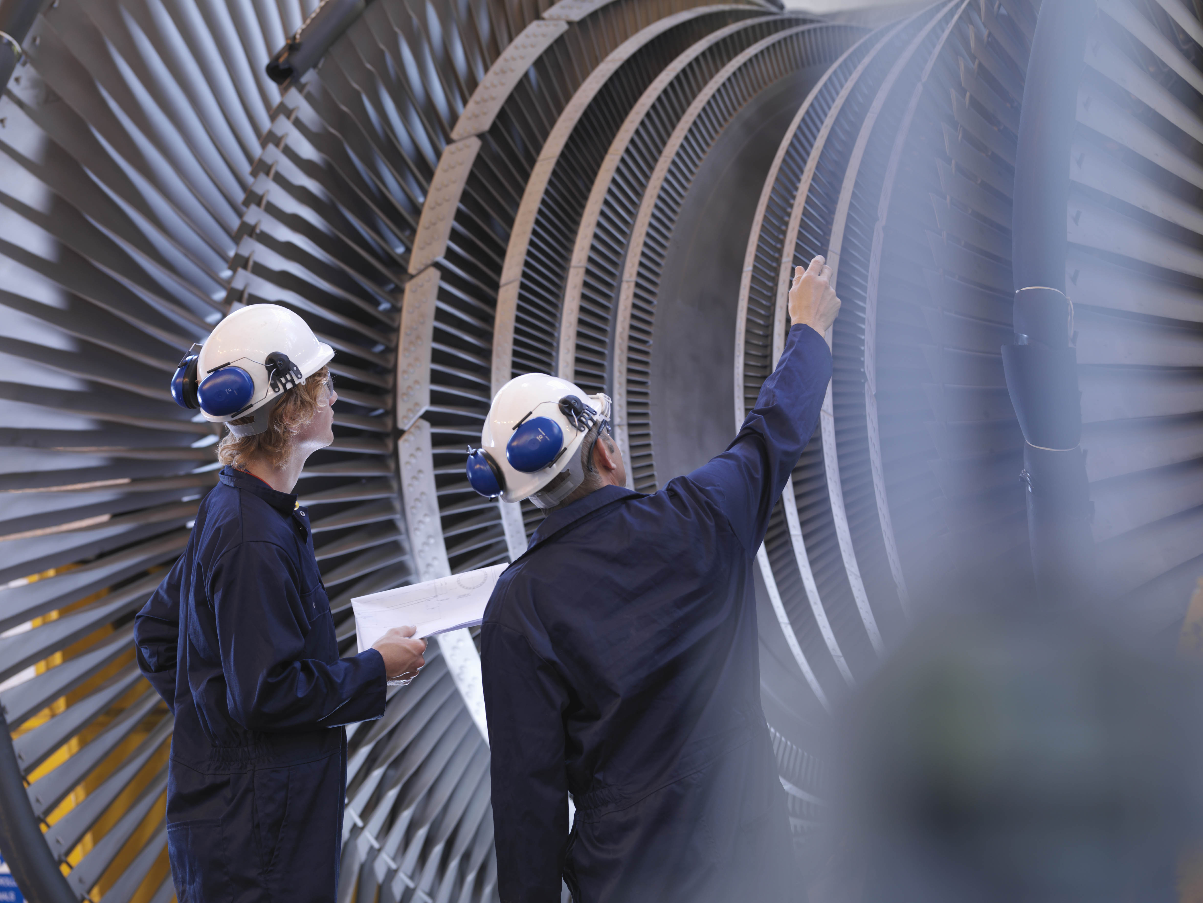 Engineers Looking At Turbine