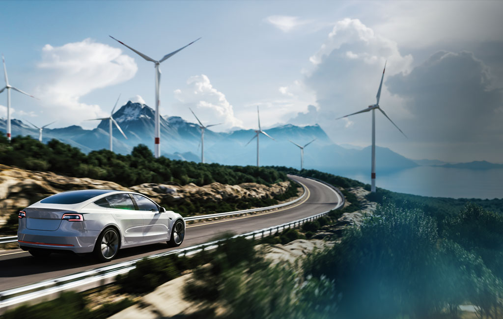 Car-on-a-road-and-wind-turbines-in-the-background